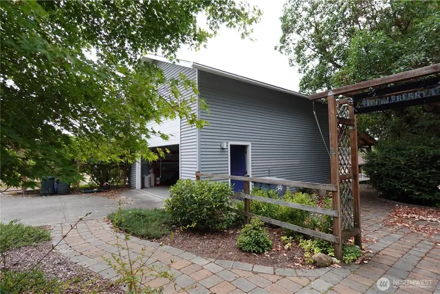 a kitchen with a table chairs refrigerator and microwave