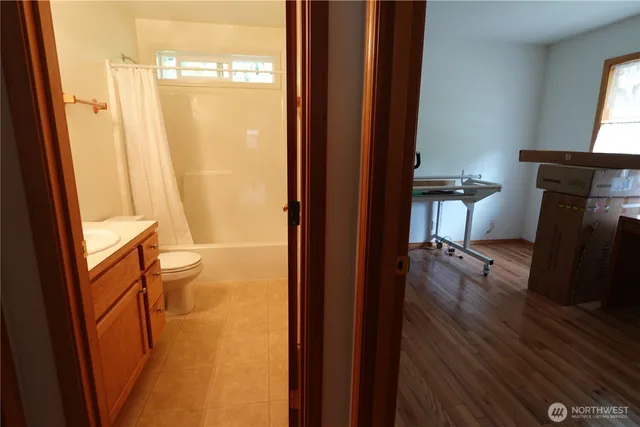 a bedroom with a bed and a dresser