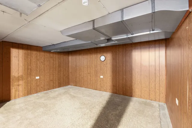 a view of a big room with wooden walls