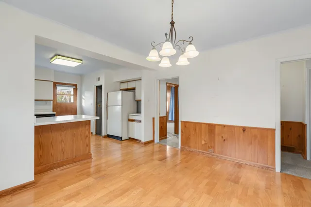 a view of a kitchen with a sink and cabinet area