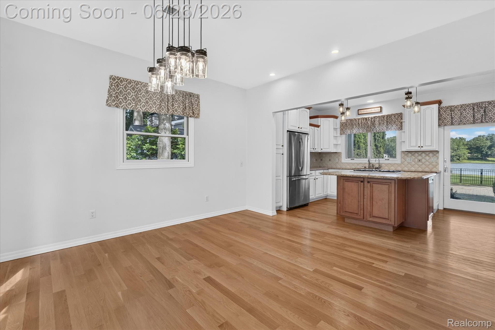 3478 Lexington Road Waterford, MI 48328 - Photo 4 of 52 Expansive room featuring wood-finish flooring, a contemporary multi-light pendant fixture, white walls, and recessed lighting
