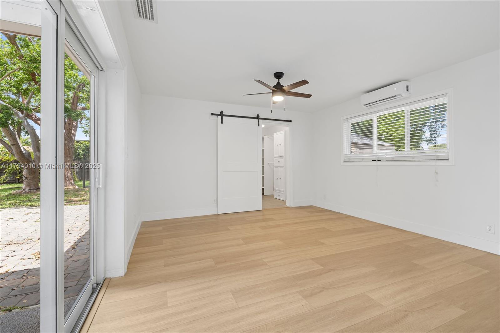 4401 Madison Street Hollywood, FL 33021 - Photo 12 of 27 a view of room with a ceiling fan and window