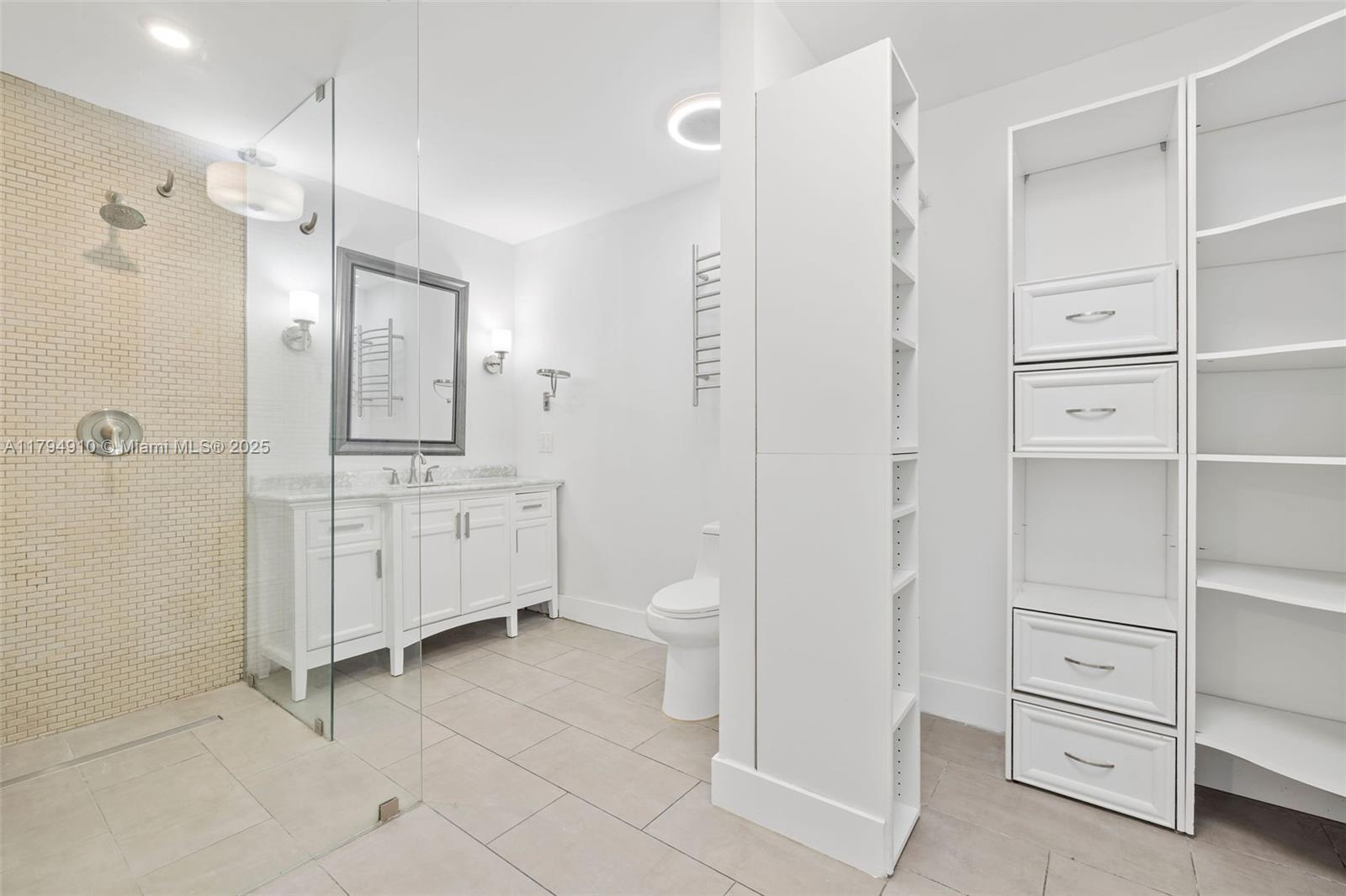 4401 Madison Street Hollywood, FL 33021 - Photo 14 of 27 a bathroom with a double vanity sink toilet and shower