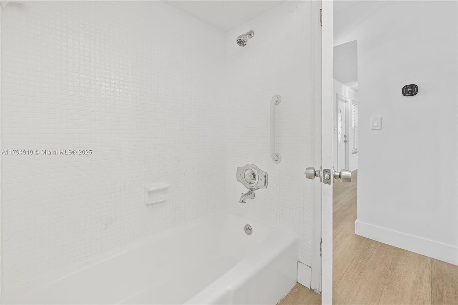 4401 Madison Street Hollywood, FL 33021 - Photo 21 of 27 a bathroom with a bathtub