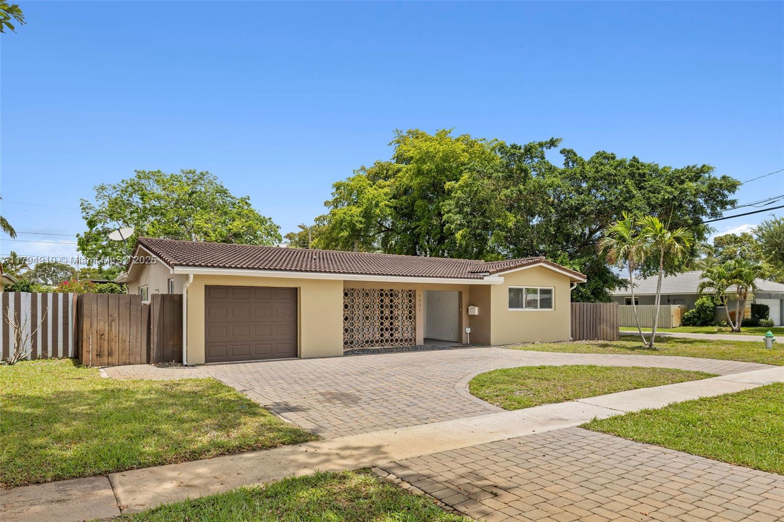 4401 Madison Street Hollywood, FL 33021 - Photo 23 of 27 a front view of a house with a yard