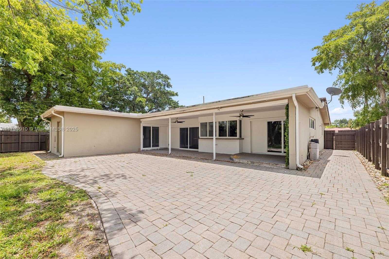 4401 Madison Street Hollywood, FL 33021 - Photo 24 of 27 a front view of a house with a yard