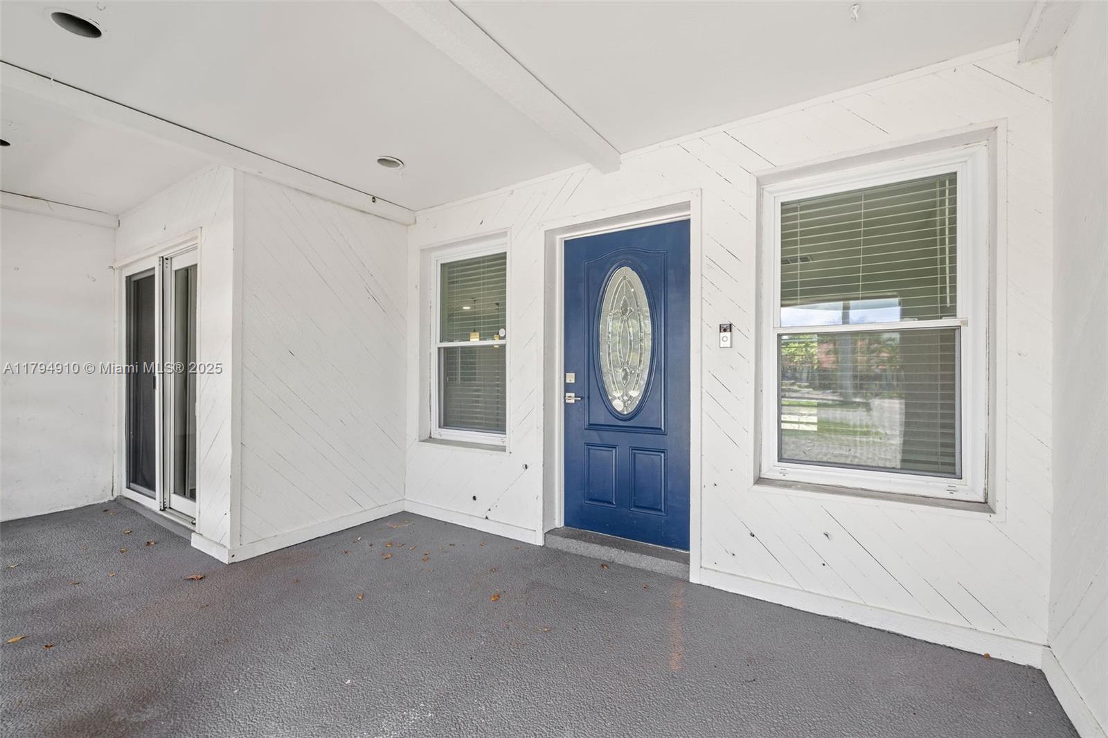 4401 Madison Street Hollywood, FL 33021 - Photo 3 of 27 an empty room with window closet and windows