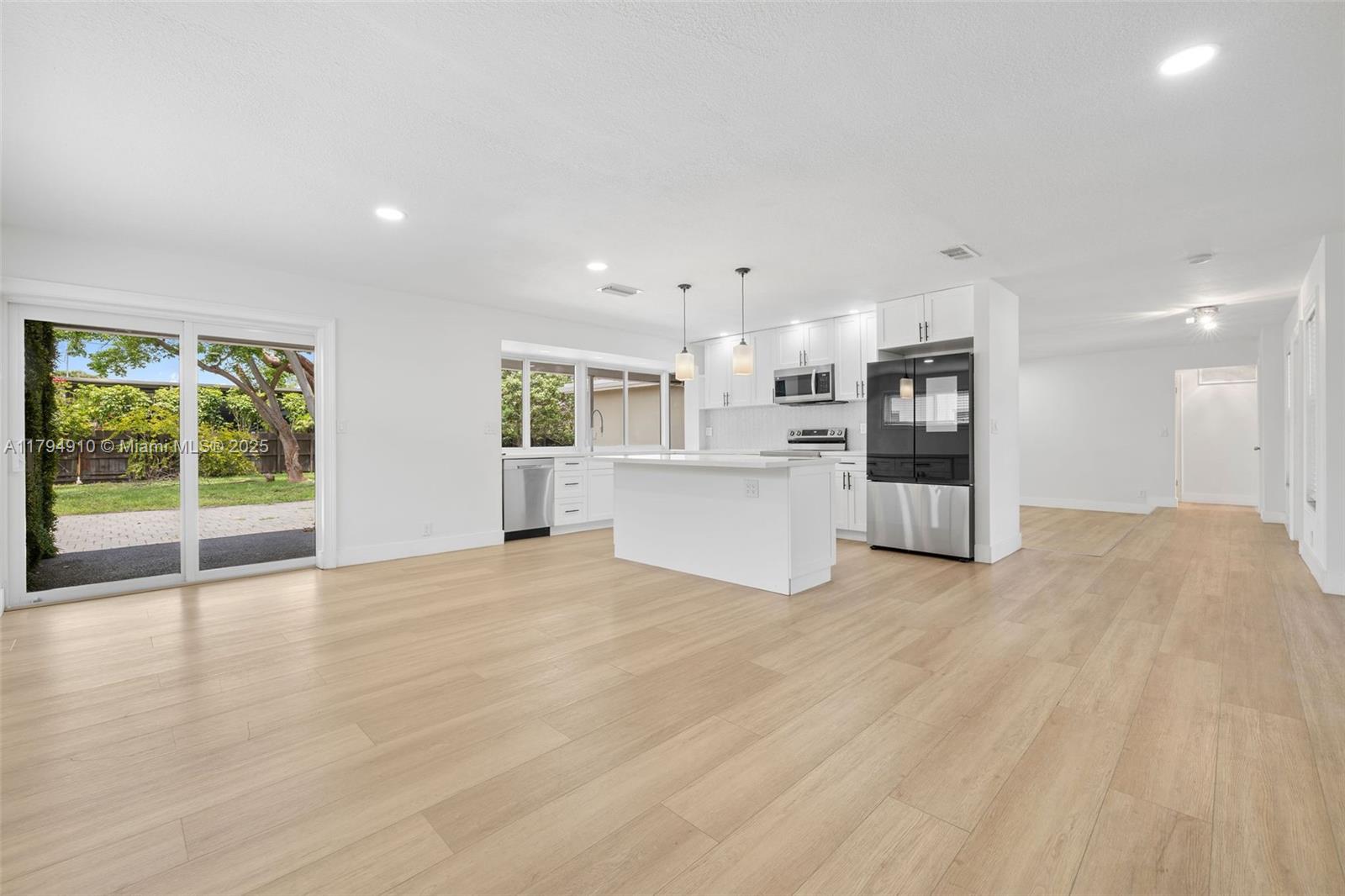 4401 Madison Street Hollywood, FL 33021 - Photo 8 of 27 a view of a kitchen with a sink and a window