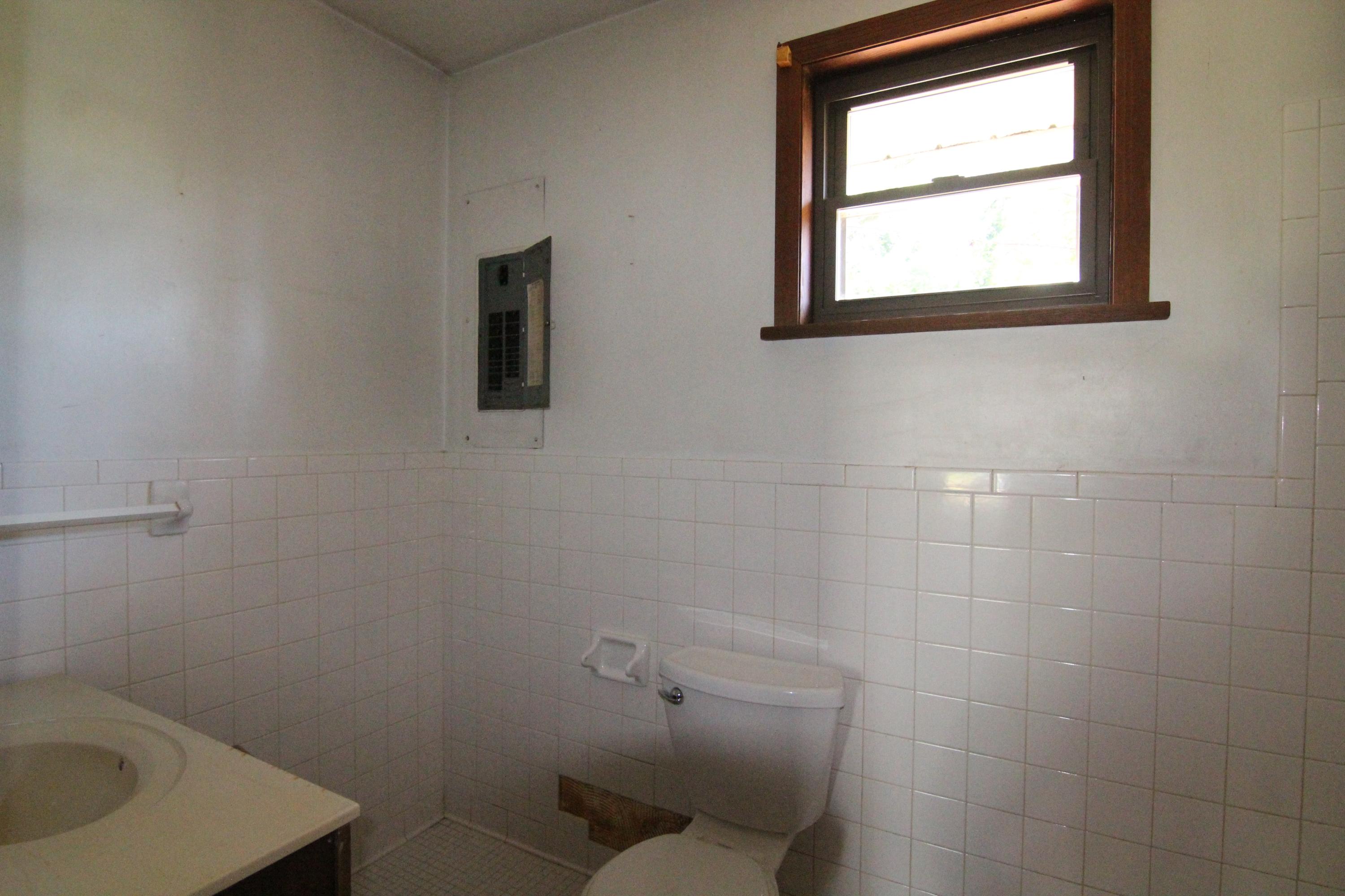 5474 Blue Ridge Boulevard Blue Ridge, VA 24064 - Photo 17 of 22 a bathroom with a toilet sink and mirror