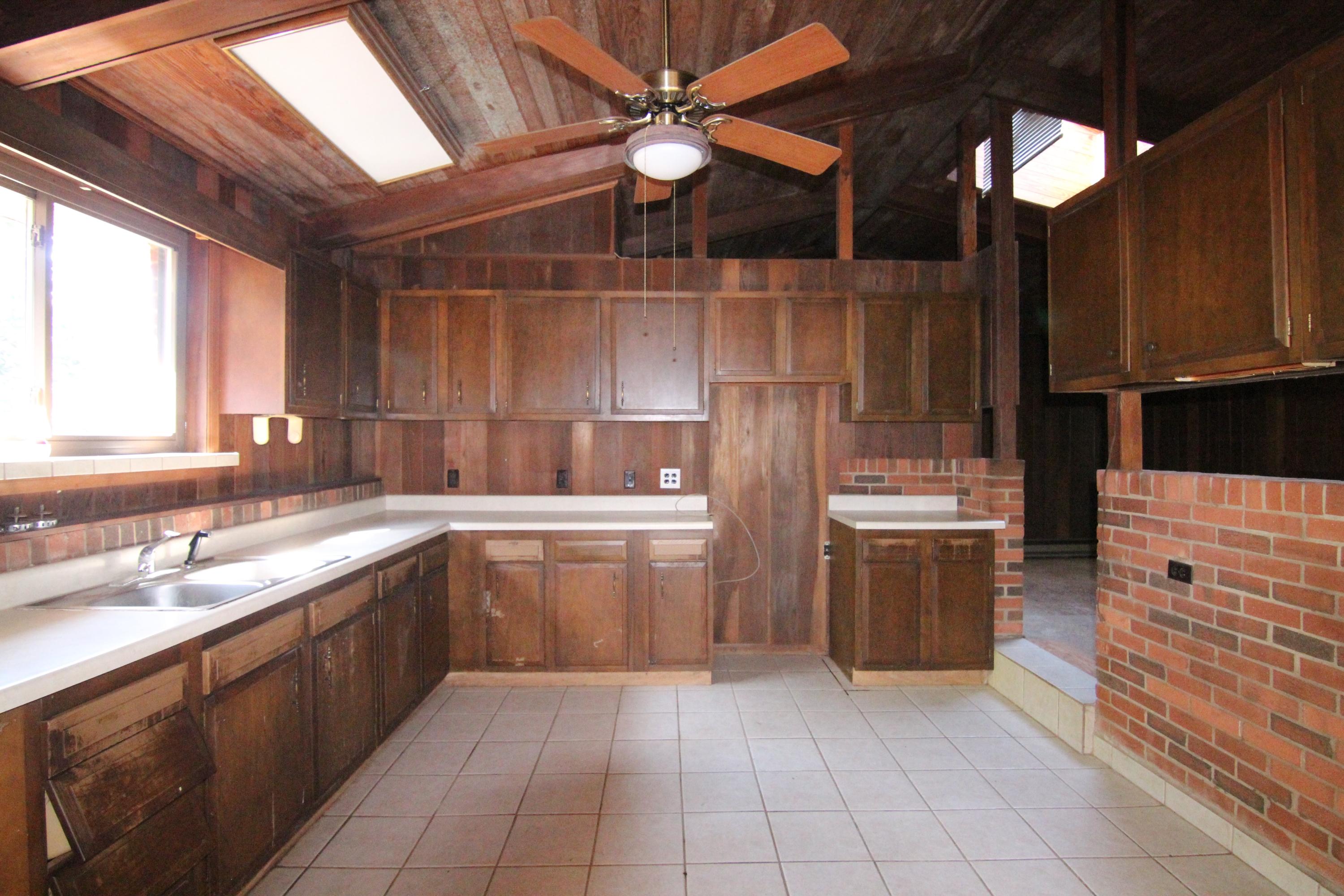 5474 Blue Ridge Boulevard Blue Ridge, VA 24064 - Photo 8 of 22 a kitchen with a sink and cabinets