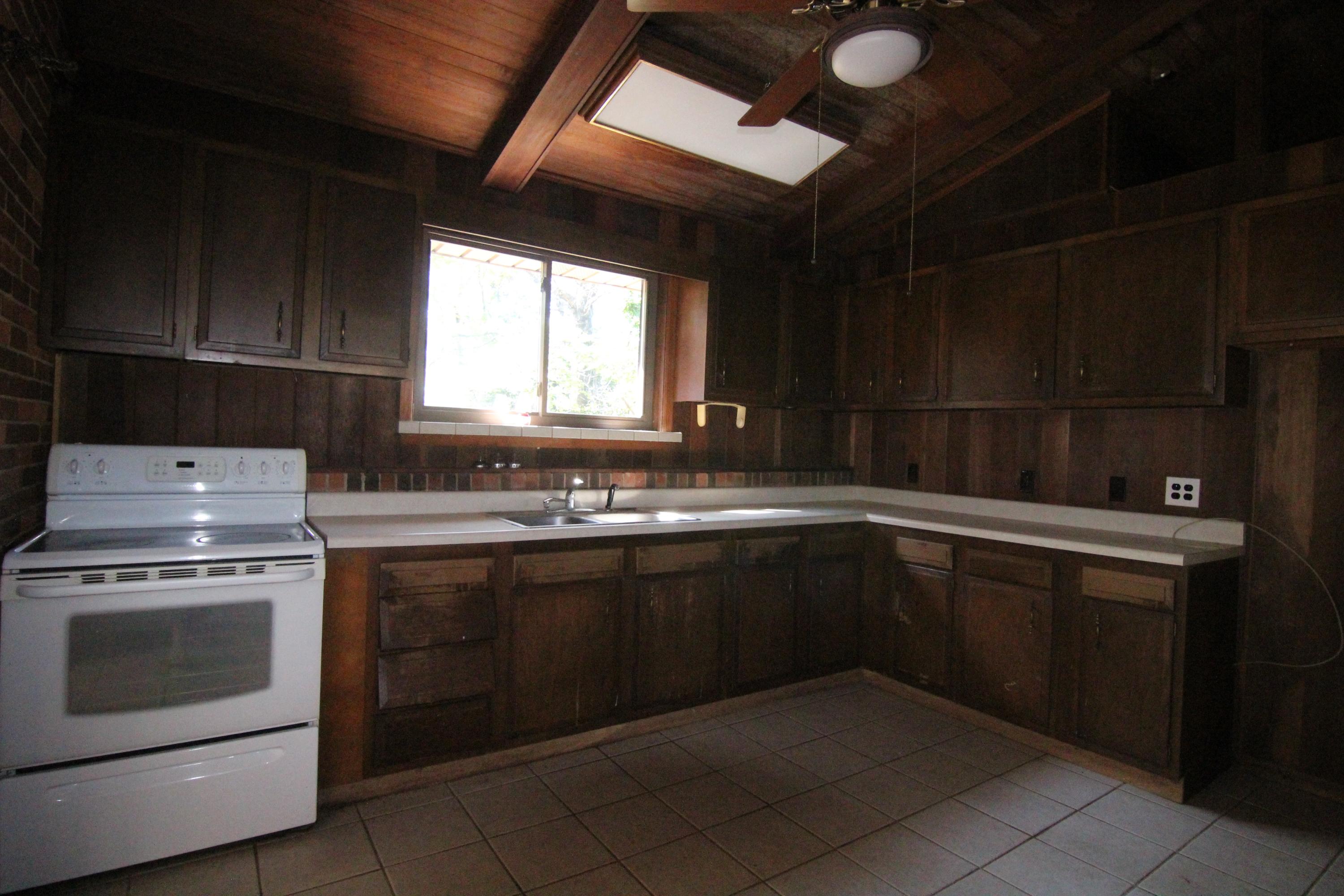 5474 Blue Ridge Boulevard Blue Ridge, VA 24064 - Photo 9 of 22 a kitchen with a sink stove and cabinets