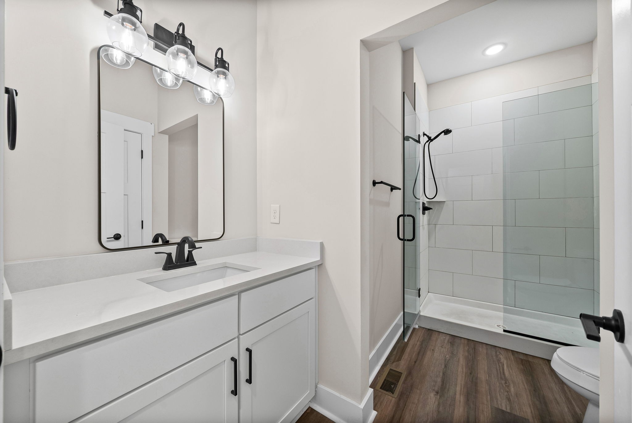 434 Centre Street Pleasant View, TN 37146 - Photo 23 of 44 a bathroom with a sink a mirror and shower