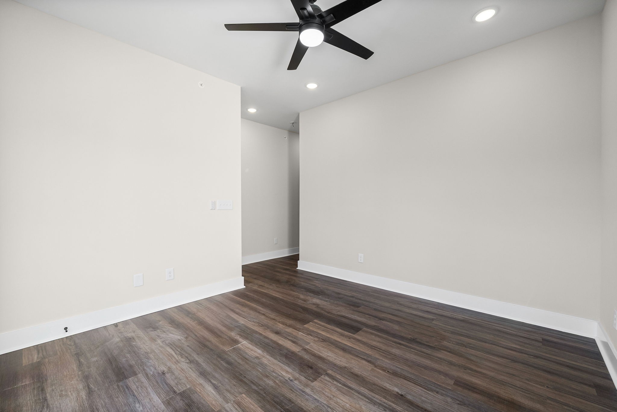 434 Centre Street Pleasant View, TN 37146 - Photo 26 of 44 an empty room with wooden floor and windows