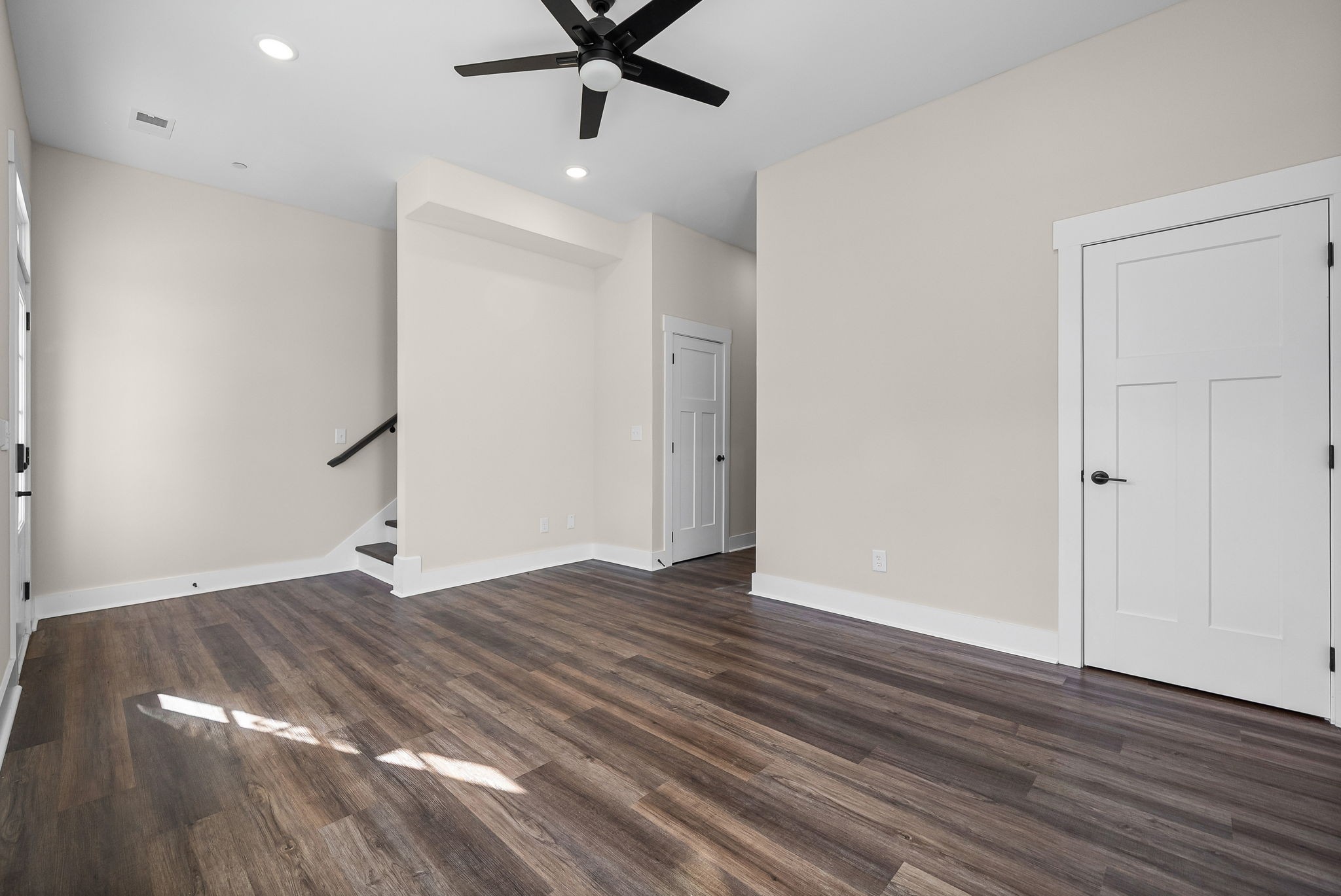 434 Centre Street Pleasant View, TN 37146 - Photo 3 of 44 an empty room with wooden floor and fan
