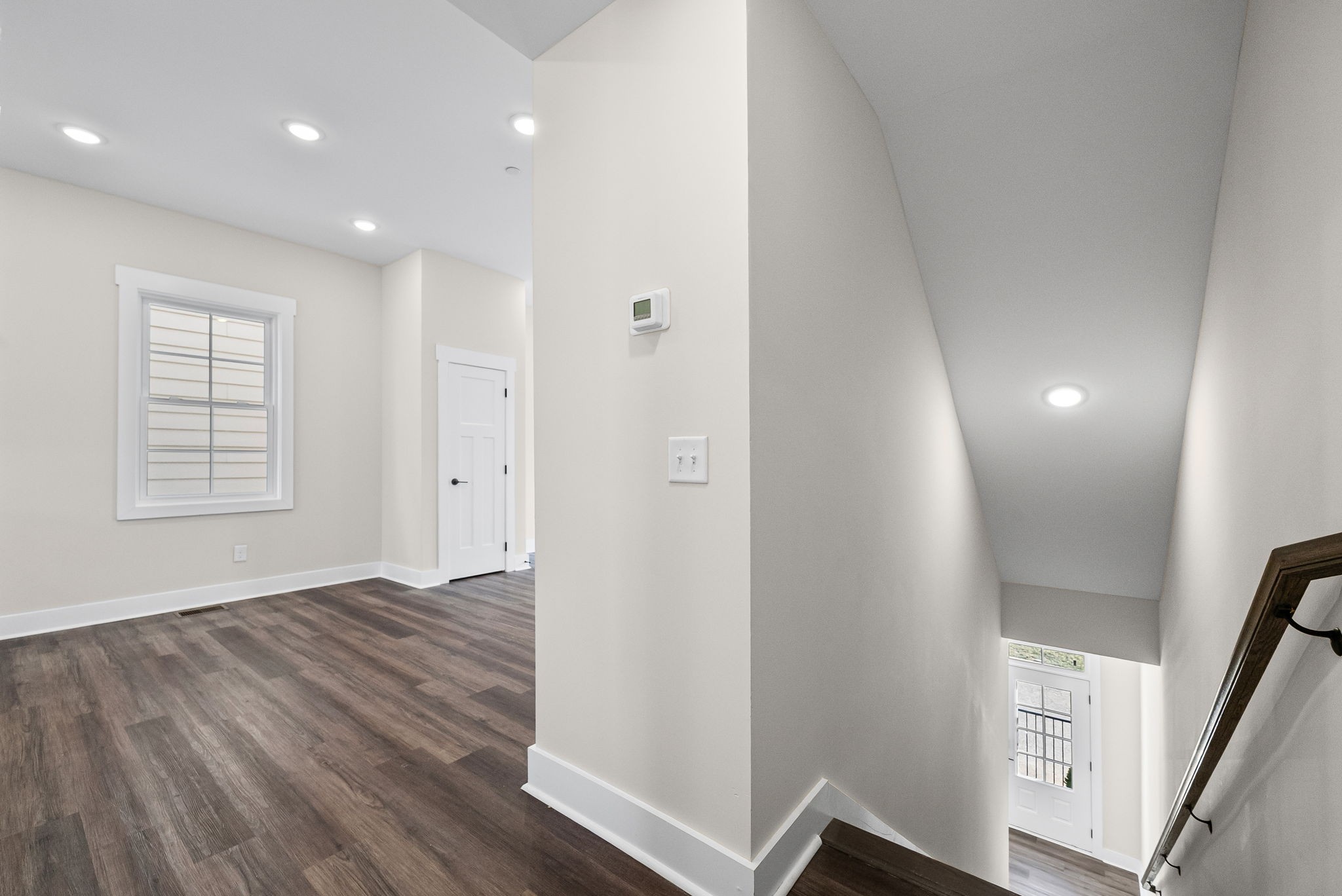 434 Centre Street Pleasant View, TN 37146 - Photo 6 of 44 a view of an empty room with wooden floor and a window