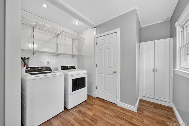 a view of kitchen with stainless steel appliances granite countertop a stove a refrigerator and a cabinets