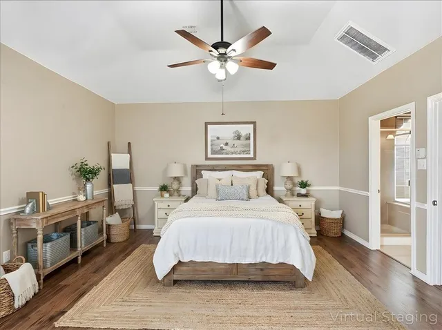 a dining room with furniture a chandelier and wooden floor