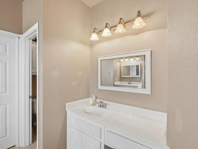 a bedroom with a large bed and a large window