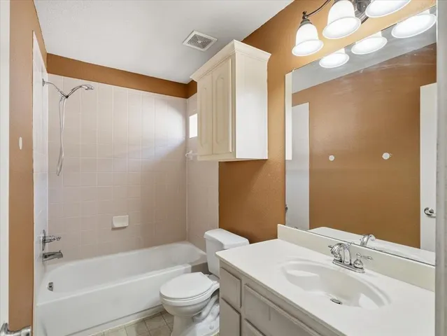 a bedroom with furniture and a fireplace