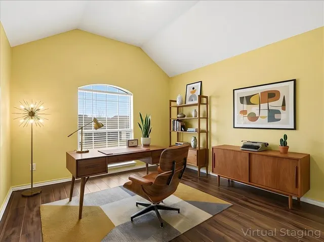 a view of bedroom with furniture and wooden floor