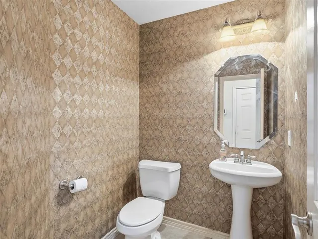 a bathroom with a sink a vanity and a mirror