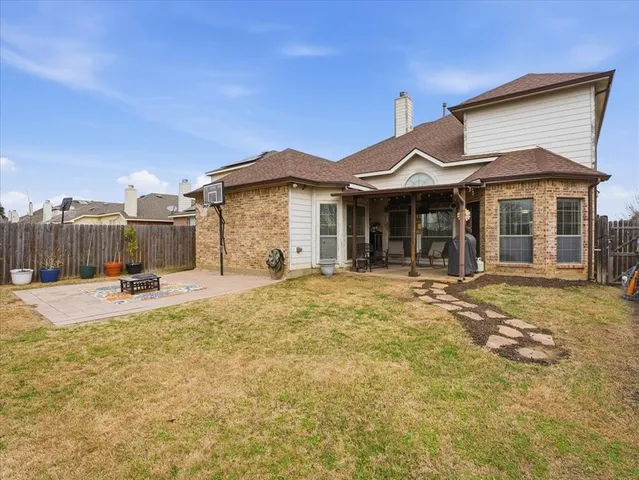 a bathroom with a bathtub sink vanity and mirror