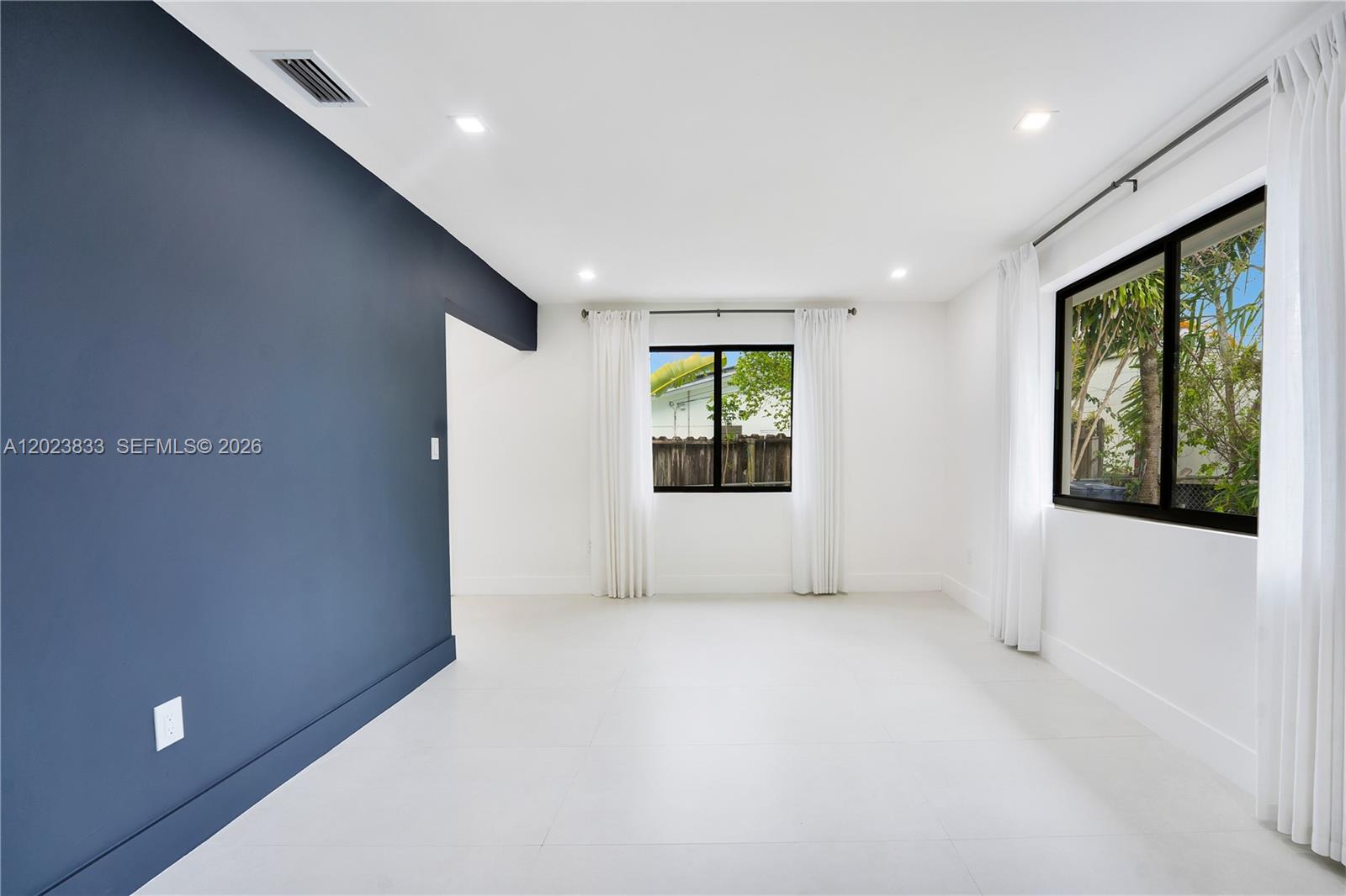 6566 Southwest 35th Street Miami, FL 33155 - Photo 6 of 36 a view of an empty room with a window