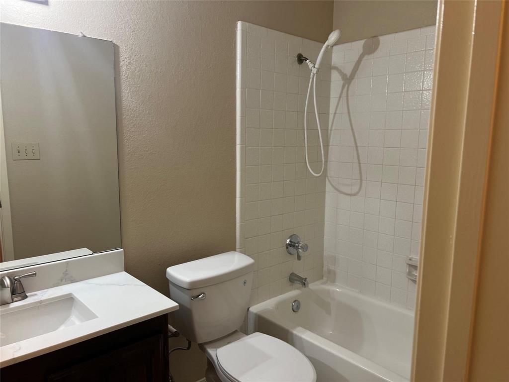 Undisclosed Address Plano, TX 75025 - Photo 14 of 15 a bathroom with a sink toilet and shower