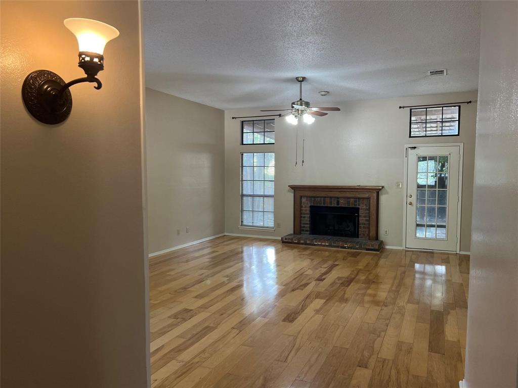 Undisclosed Address Plano, TX 75025 - Photo 2 of 15 a view of a livingroom with a fireplace