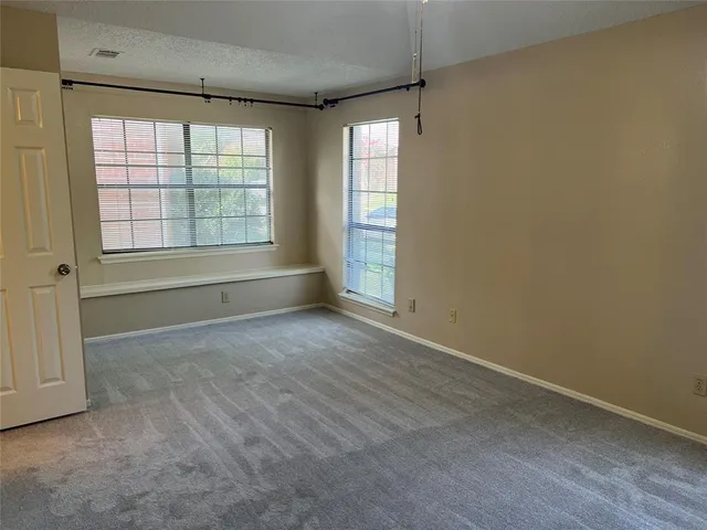 an empty room with a bathroom