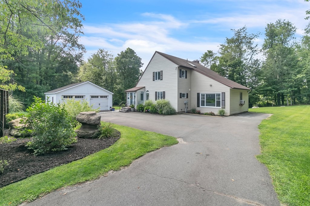 11 Pine Ridge Road Montgomery, MA 01085 - Photo 1 of 42 a front view of house with yard and green space