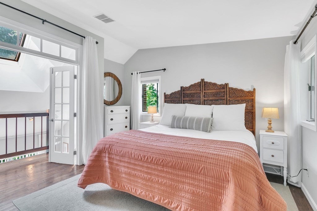 11 Pine Ridge Road Montgomery, MA 01085 - Photo 24 of 42 a bedroom with a bed mirror and a window
