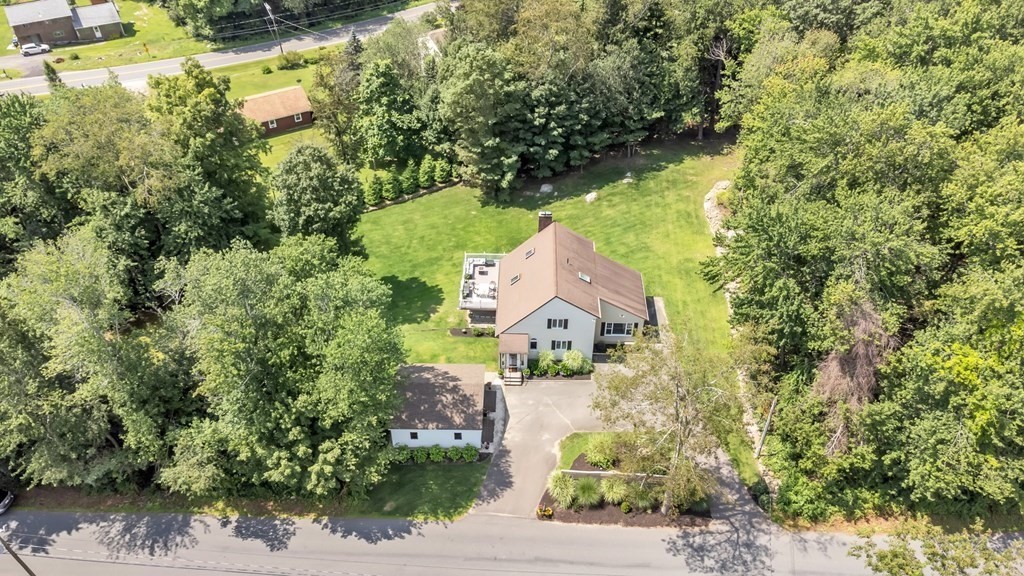 11 Pine Ridge Road Montgomery, MA 01085 - Photo 40 of 42 a aerial view of a house with a yard and large trees