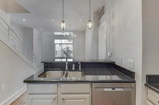 a stove top oven sitting inside of a kitchen