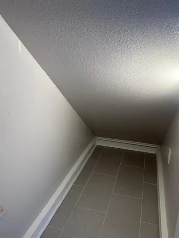 a view of storage and utility room with racks on a shelf