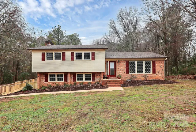 a front view of a house with a yard table and chairs