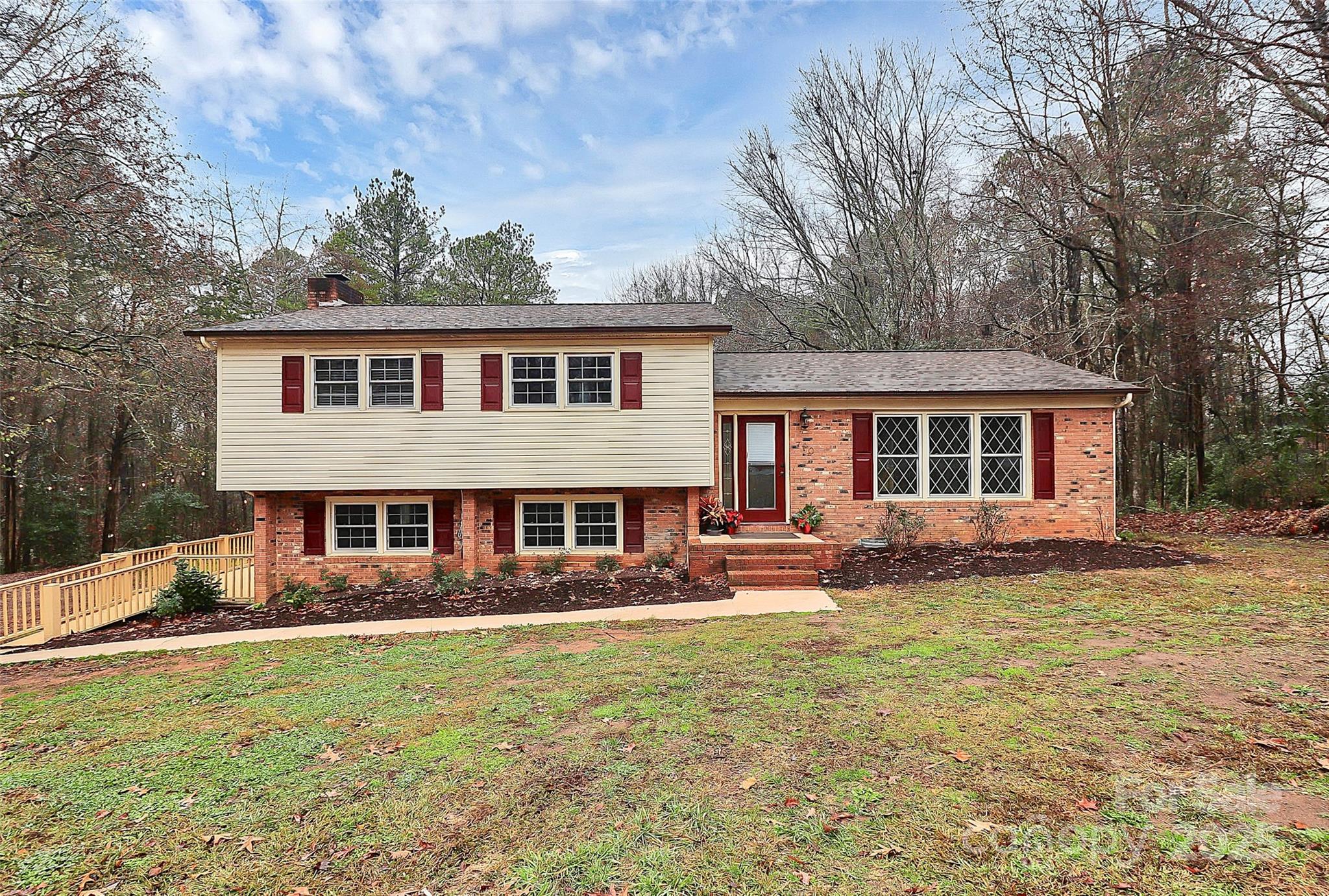 a front view of a house with a yard table and chairs