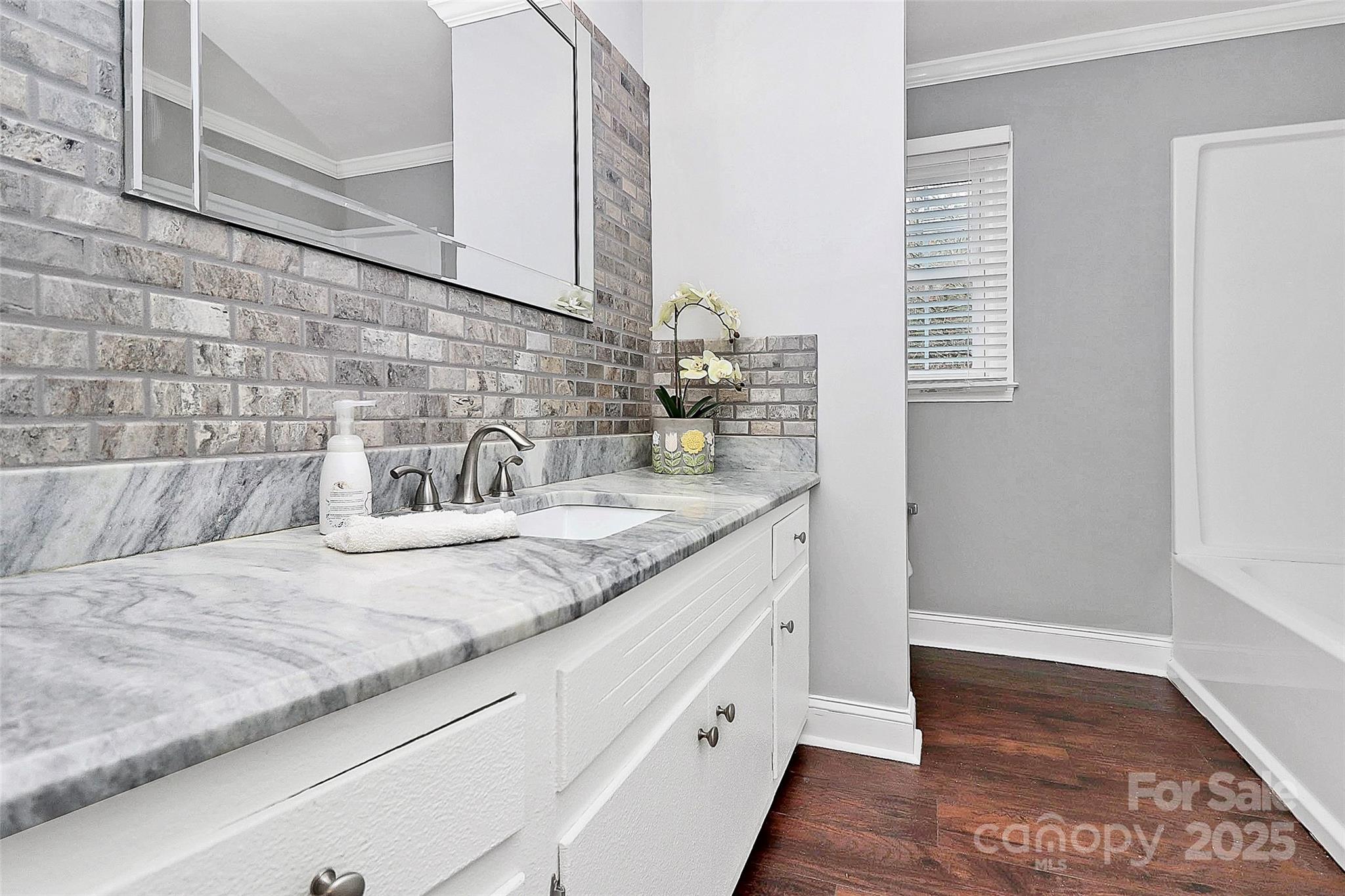 710 Plantation Road Lancaster, SC 29720 - Photo 14 of 29 a bathroom with a granite countertop sink and a mirror