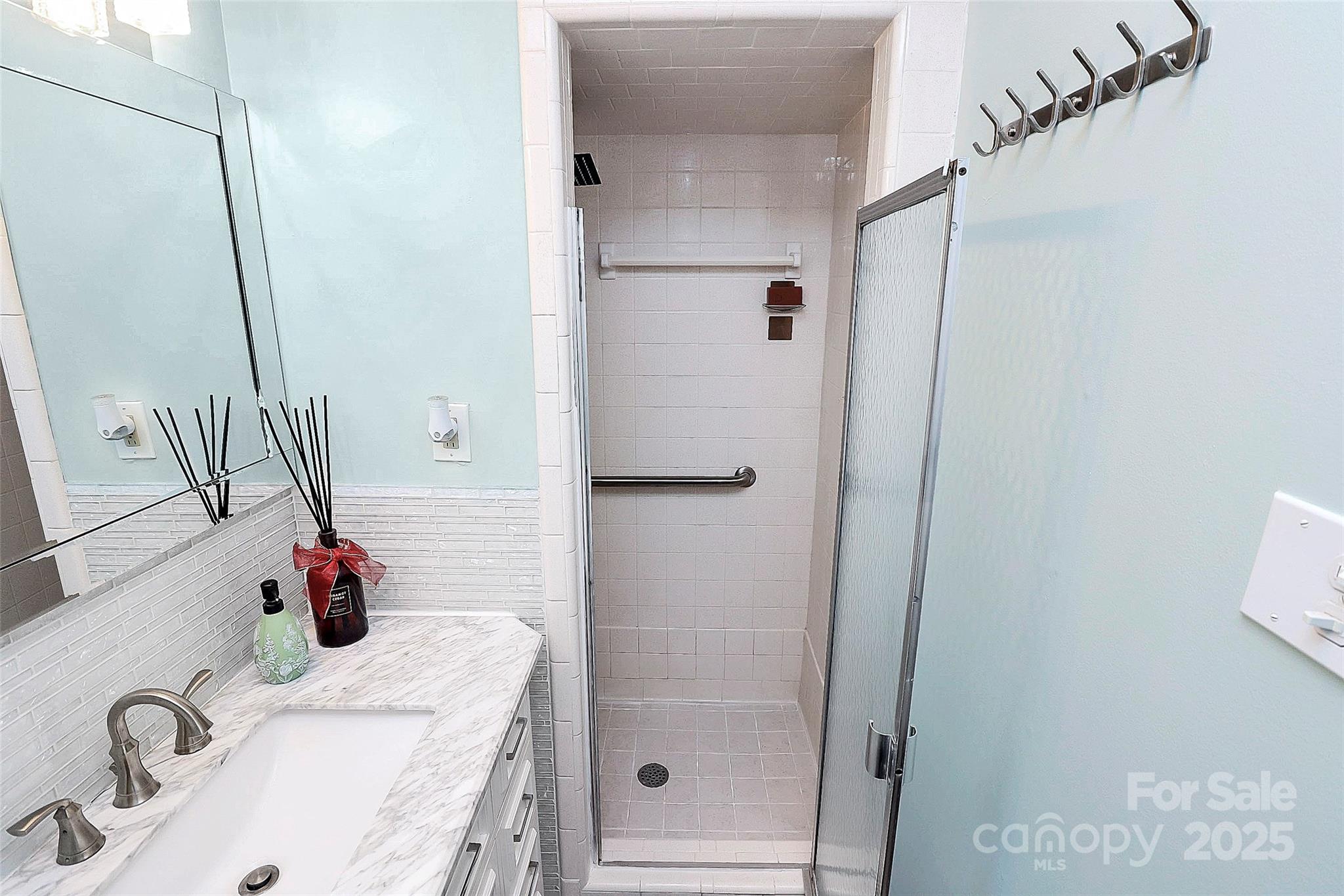 710 Plantation Road Lancaster, SC 29720 - Photo 19 of 29 a bathroom with a tub sink and mirror