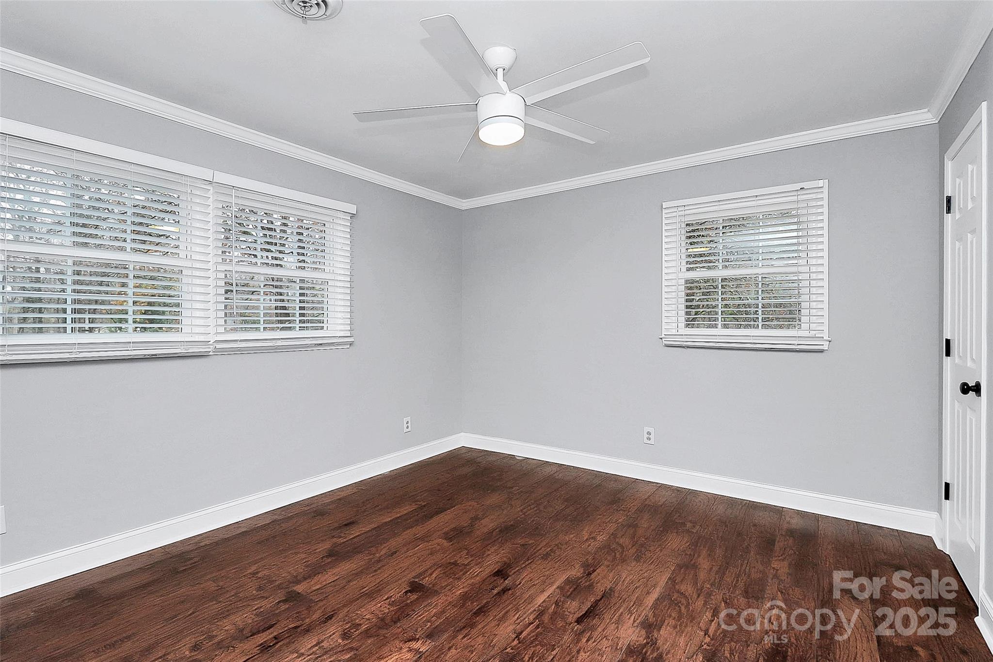 710 Plantation Road Lancaster, SC 29720 - Photo 20 of 29 a view of an empty room with wooden floor and a window