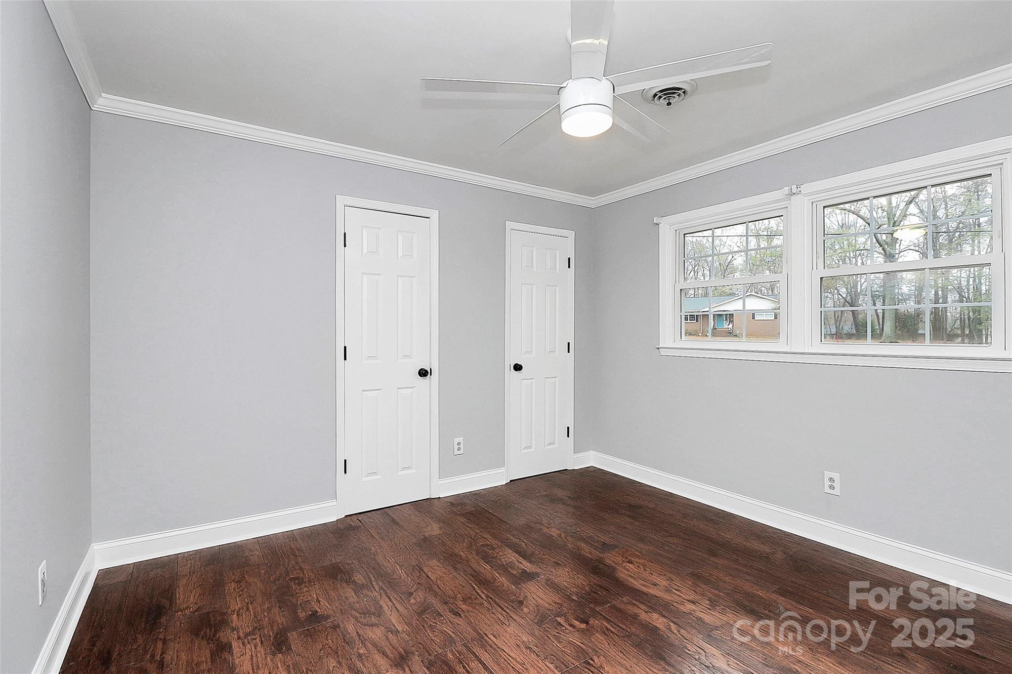 710 Plantation Road Lancaster, SC 29720 - Photo 22 of 29 a view of empty room with wooden floor and fan