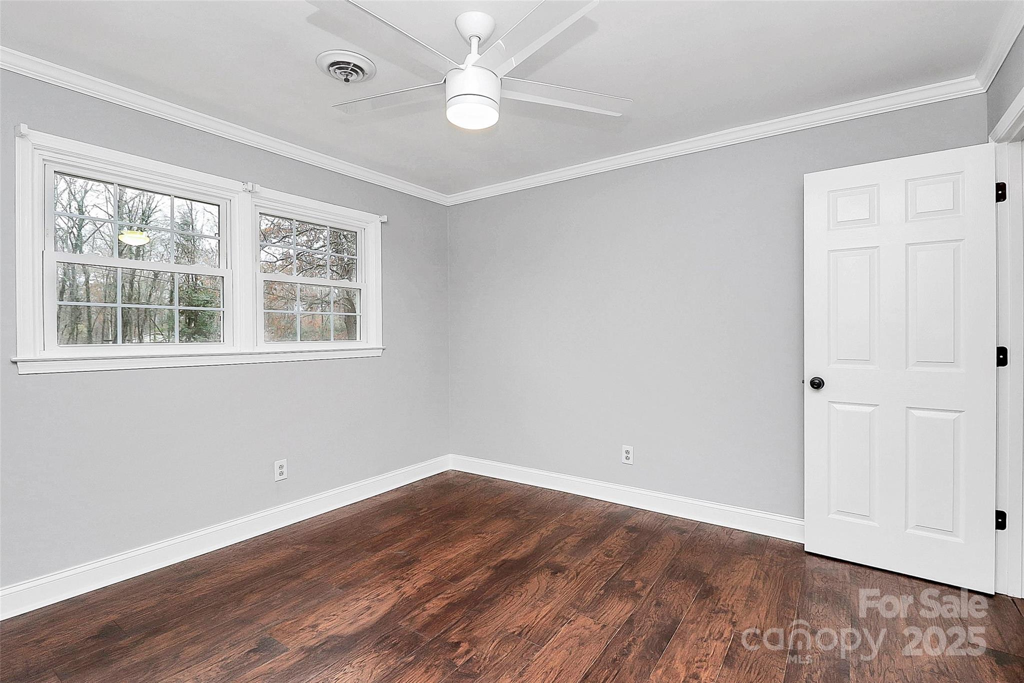 710 Plantation Road Lancaster, SC 29720 - Photo 23 of 29 wooden floor in an empty room with a window