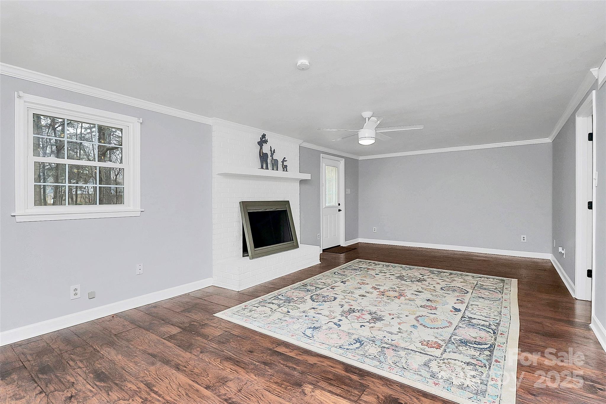 710 Plantation Road Lancaster, SC 29720 - Photo 25 of 29 a view of a livingroom with wooden floor and a fireplace