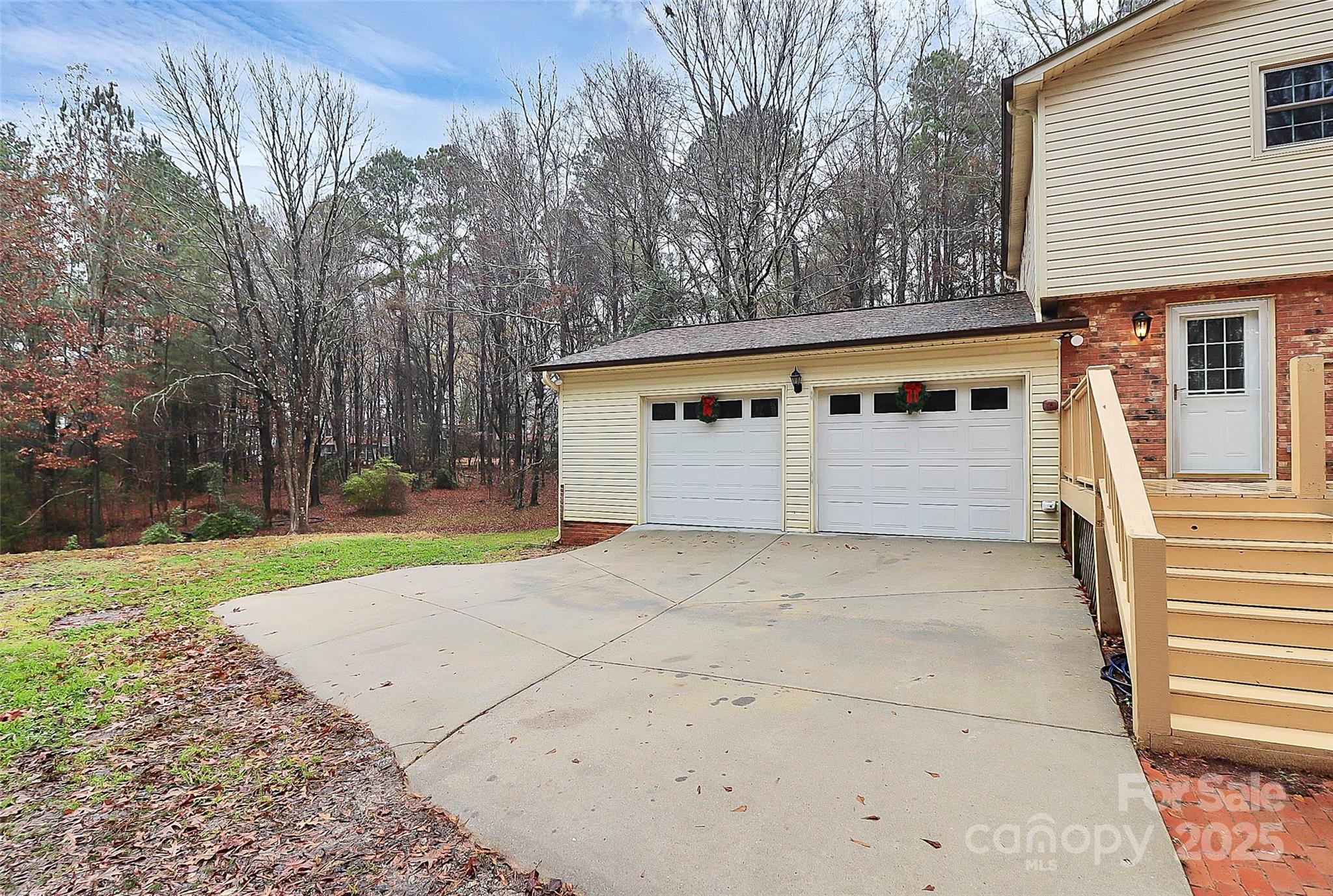 710 Plantation Road Lancaster, SC 29720 - Photo 28 of 29 a front view of a house with a yard and garage