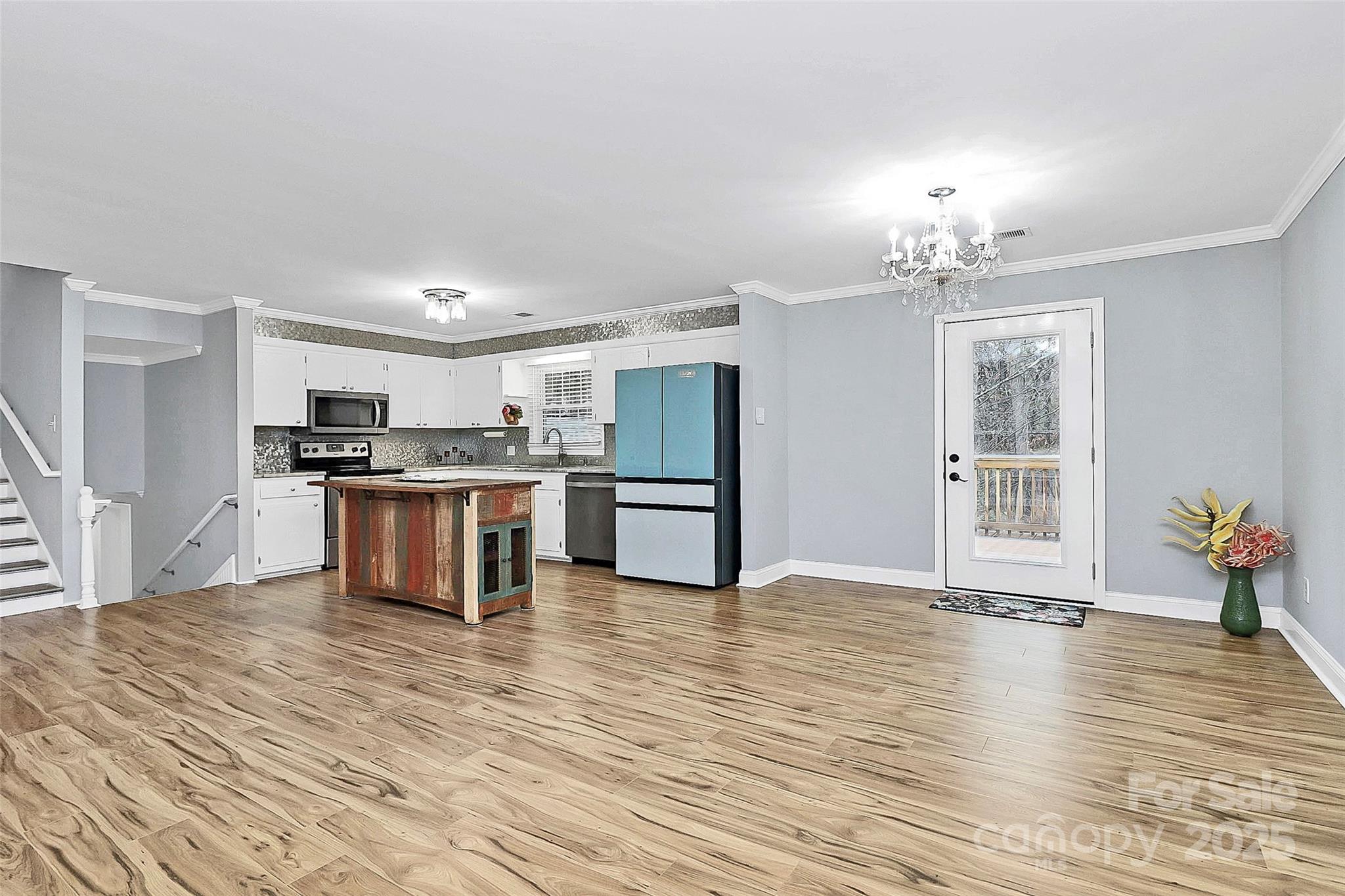 710 Plantation Road Lancaster, SC 29720 - Photo 7 of 29 a view of kitchen with granite countertop cabinets and refrigerator