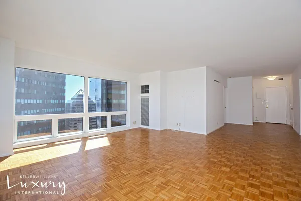 a view of an empty room with a window