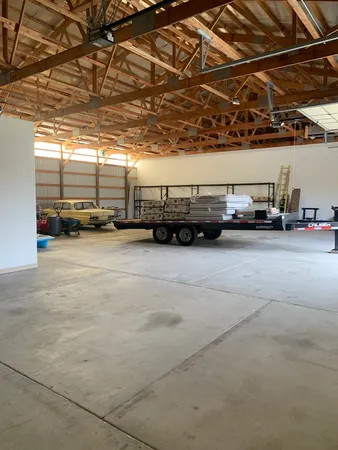 a view of parking garage with cars