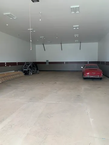 an empty room with a ceiling fan