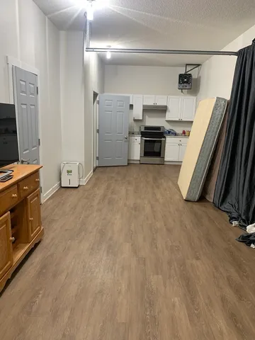 a view of a livingroom with a flat screen tv