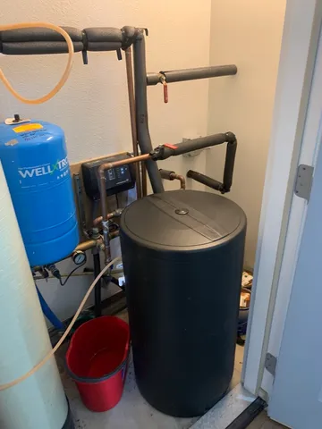 a bathroom with a sink toilet and mirror